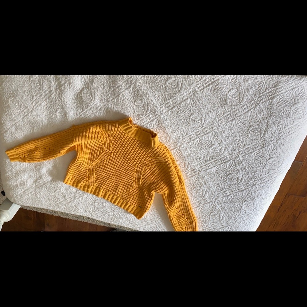 Bright yellow knit sweater